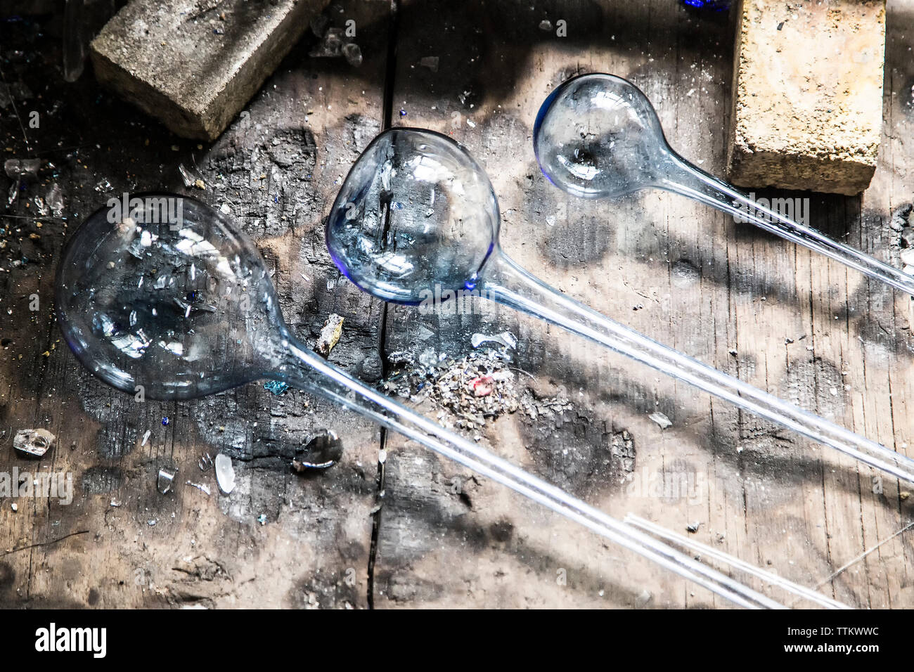 Overhead view of manufactured glasses on work bench at factory Stock Photo