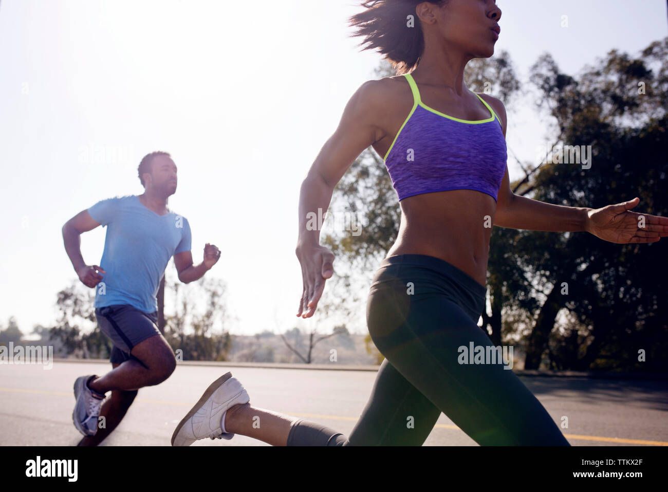 Couple jogging on street Stock Photo