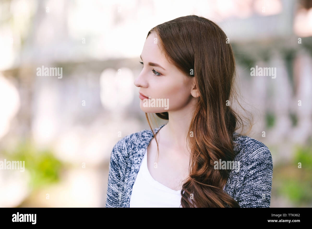 Portrait of beautiful girl in park Stock Photo - Alamy