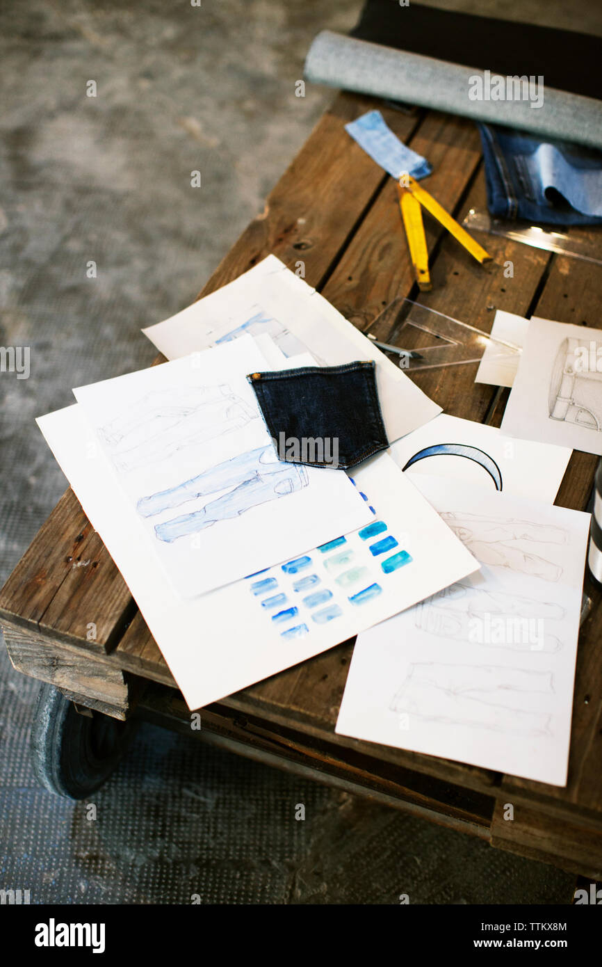 High angle view of fashion design documents on wooden table Stock Photo