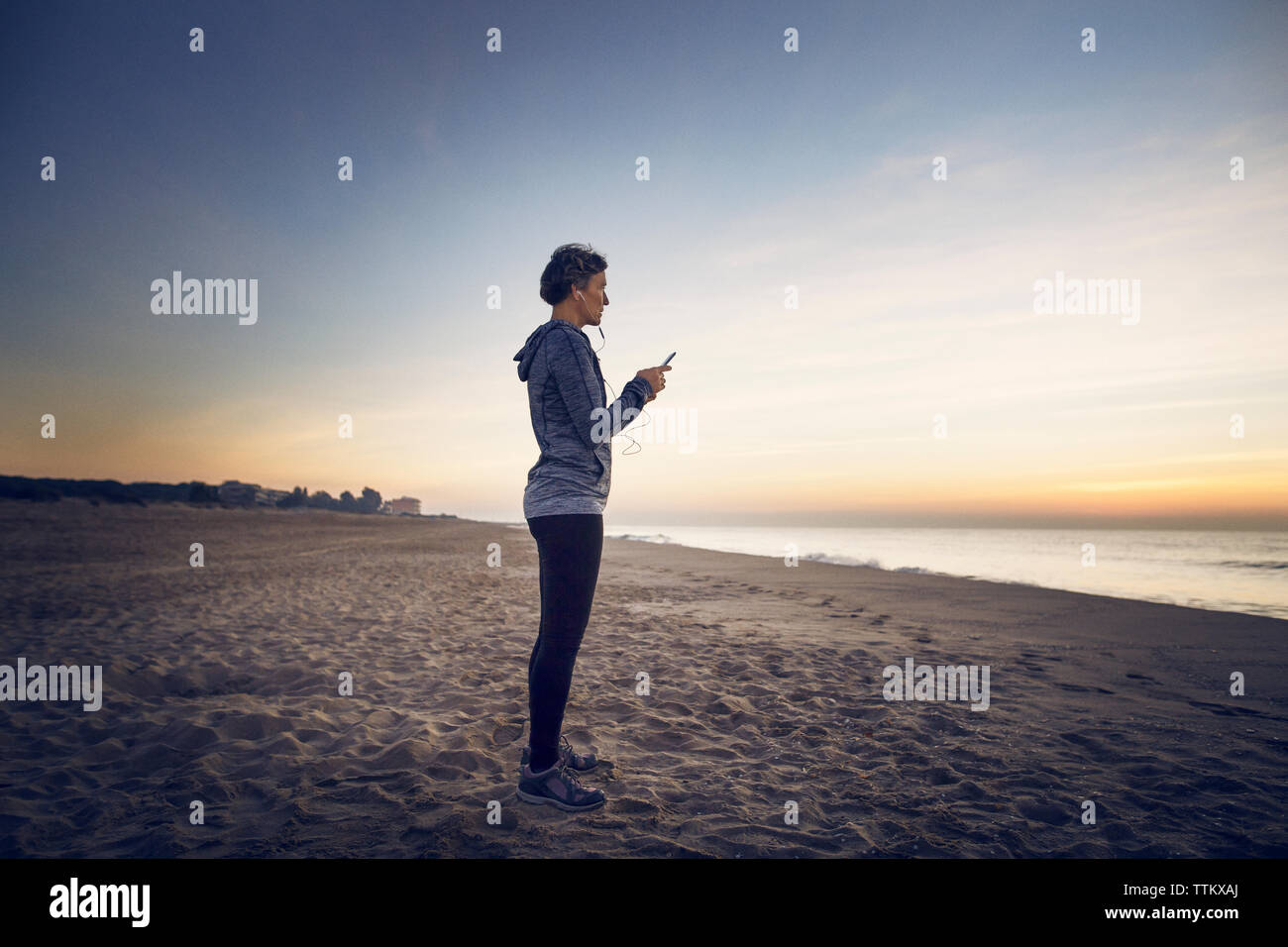 Mature woman beach mobile phone hi-res stock photography and images - Alamy