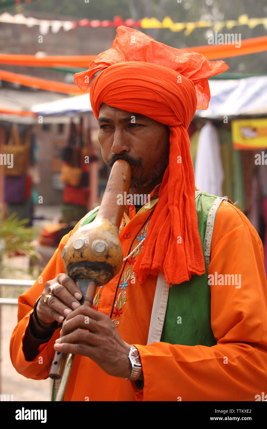 Snake charmer playing pungi, Dilli Haat, New Delhi, India Stock Photo Alamy