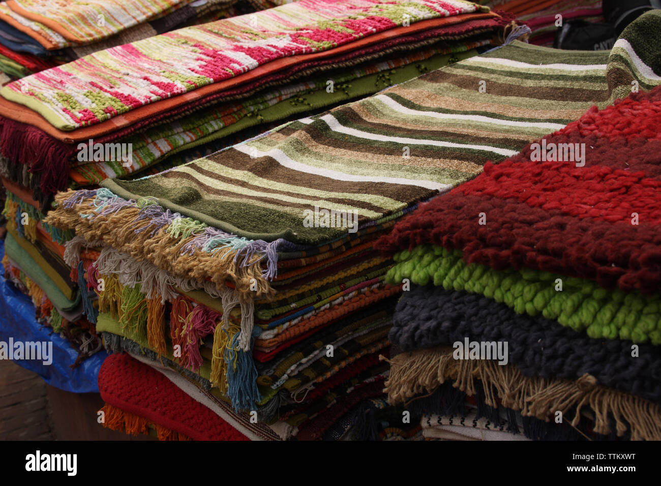 Stacks of doormats at a market stall, Dilli Haat, New delhi, India Stock Photo