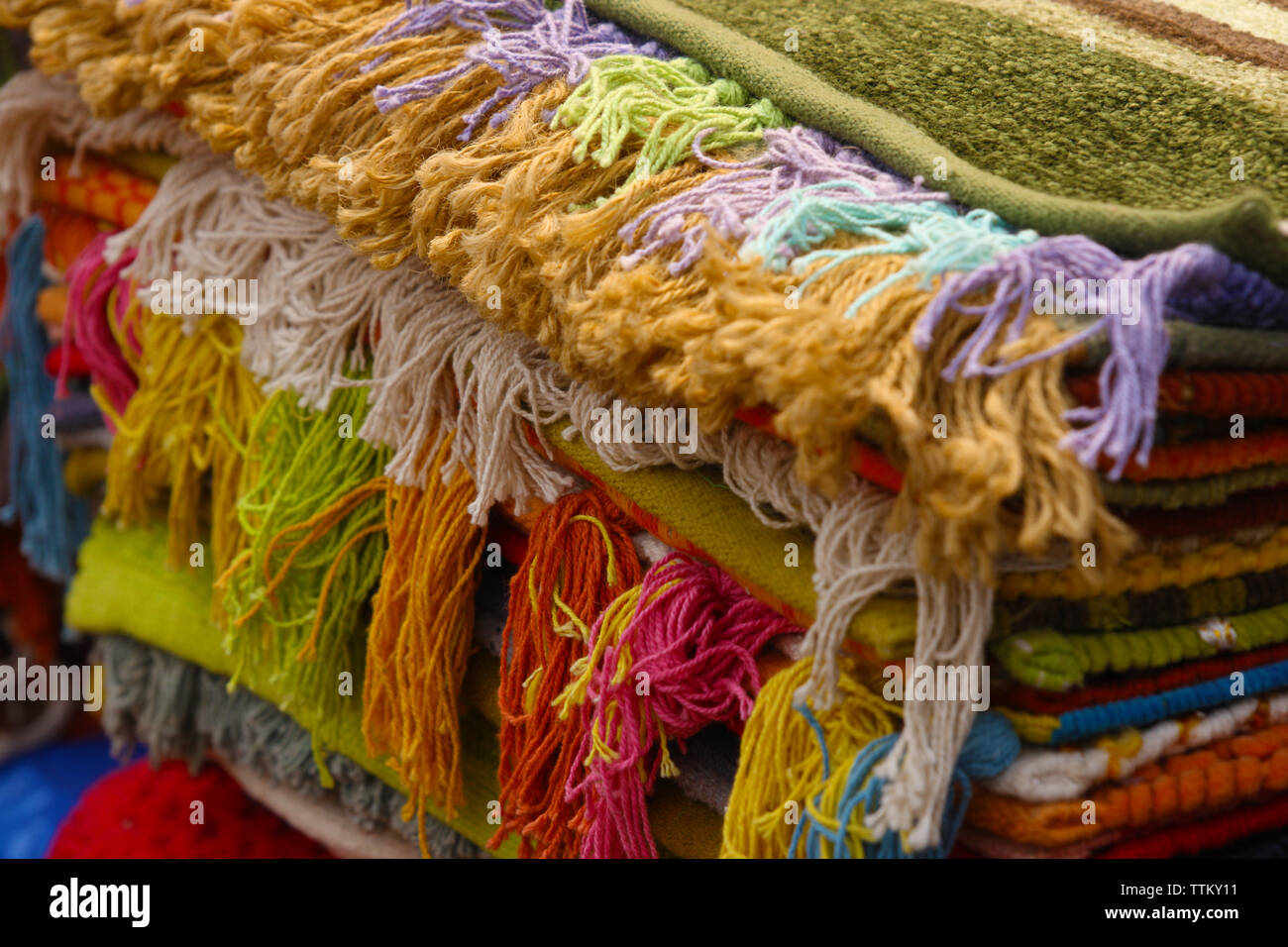 Stack of doormat at market stall, Dilli Haat, New Delhi, India Stock Photo