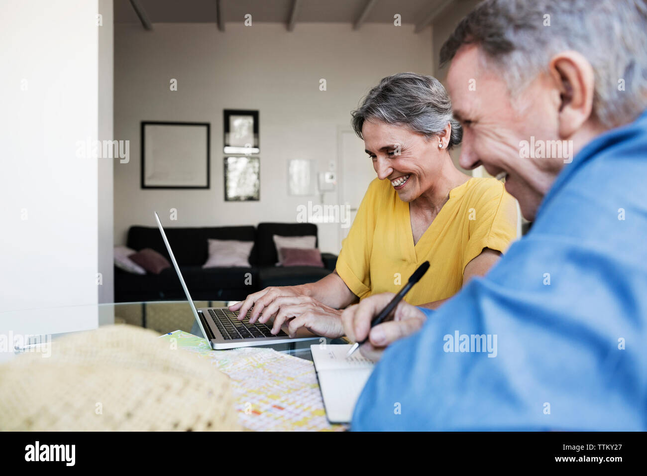Planning vacation laptop map hi-res stock photography and images - Alamy