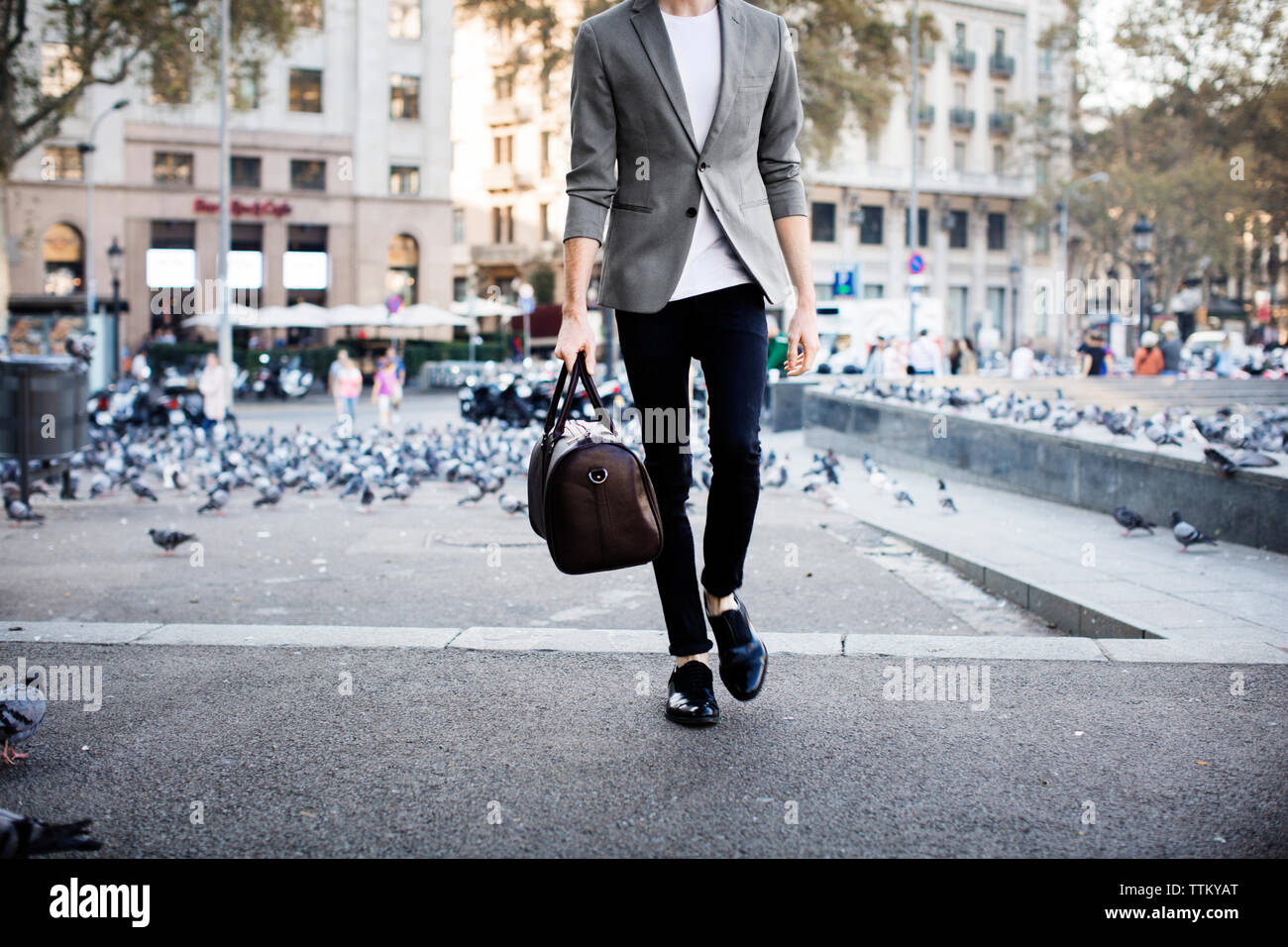 Man walking with pigeons hi-res stock photography and images - Alamy