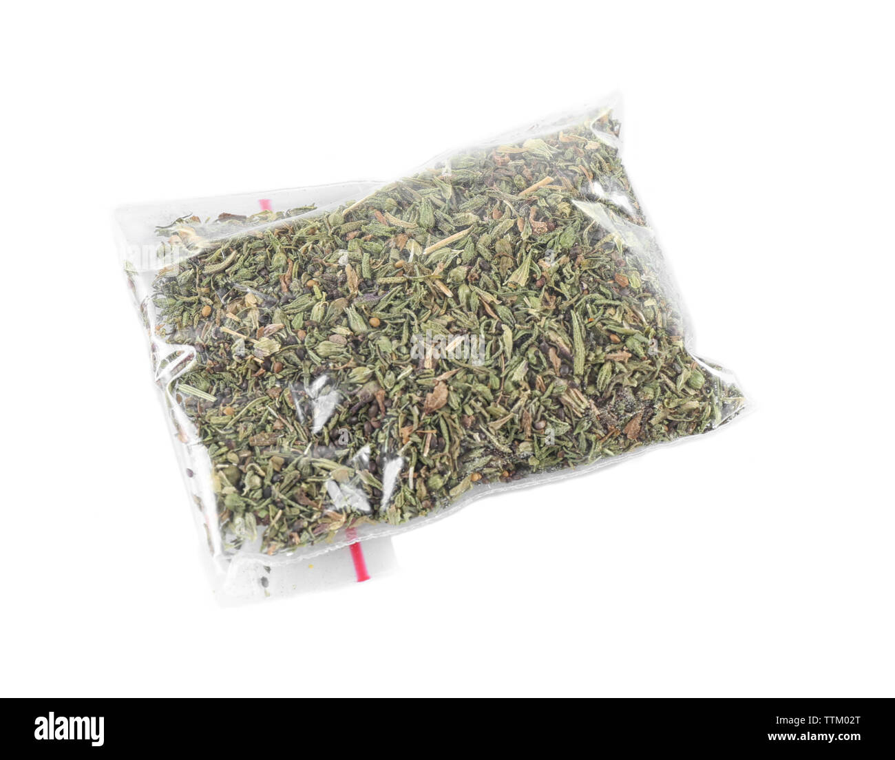 Dried tarragon in plastic zipper bag, isolated on white Stock Photo