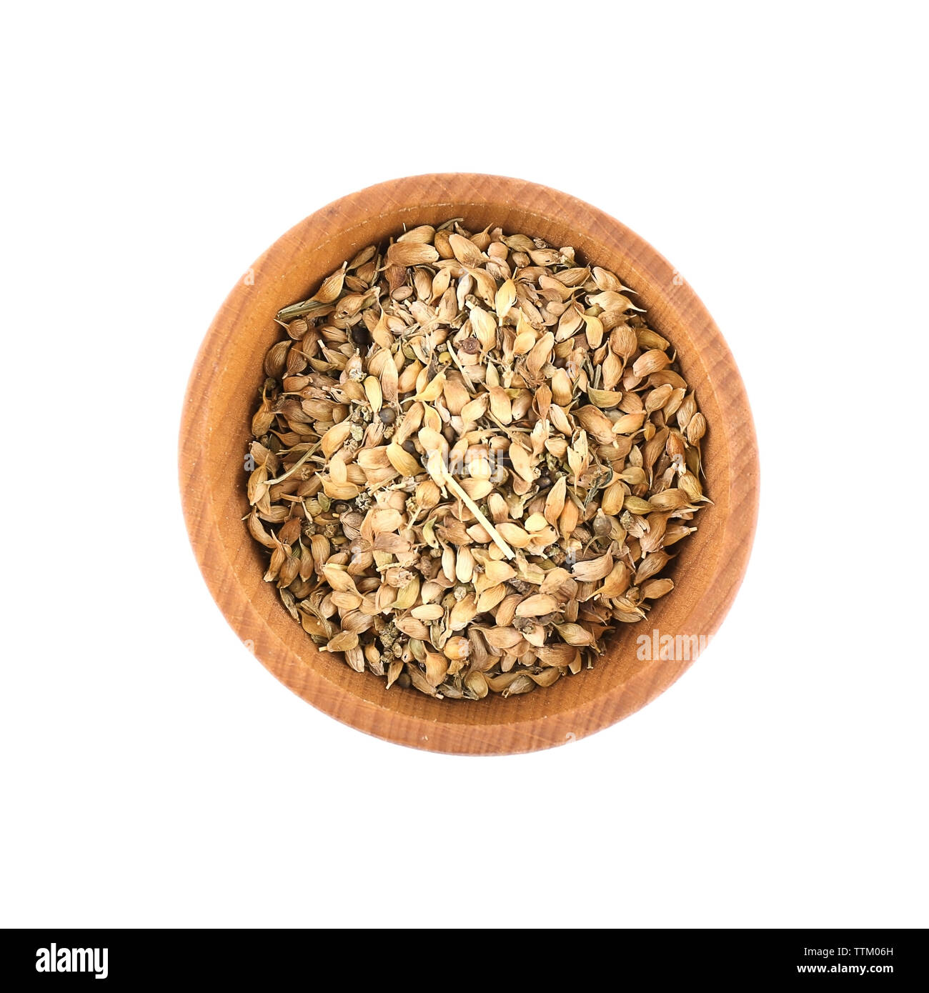 Dried utsho suneli in small wooden bowl isolated on white Stock Photo ...