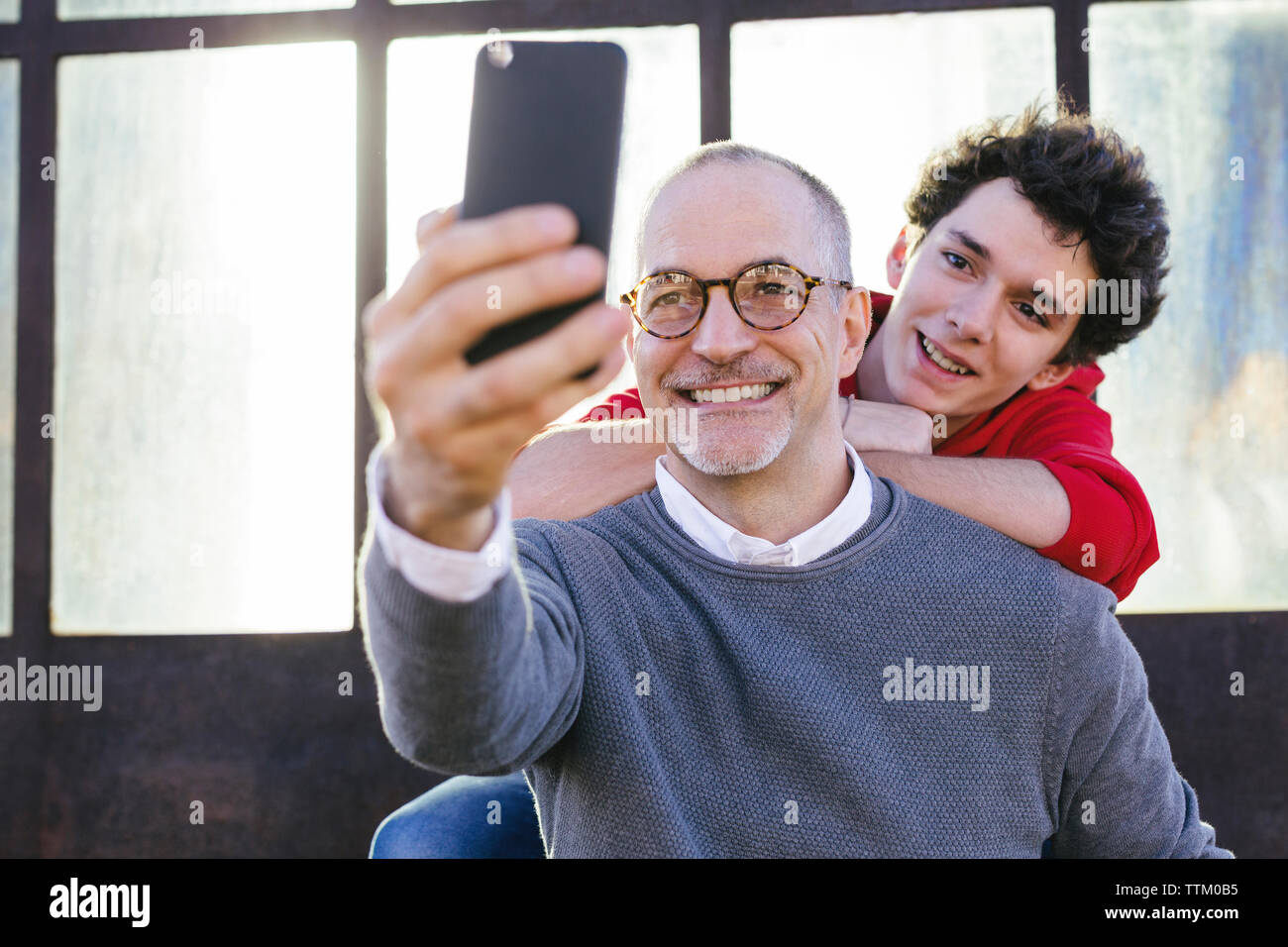 Happy father taking selfie with son Stock Photo Alamy