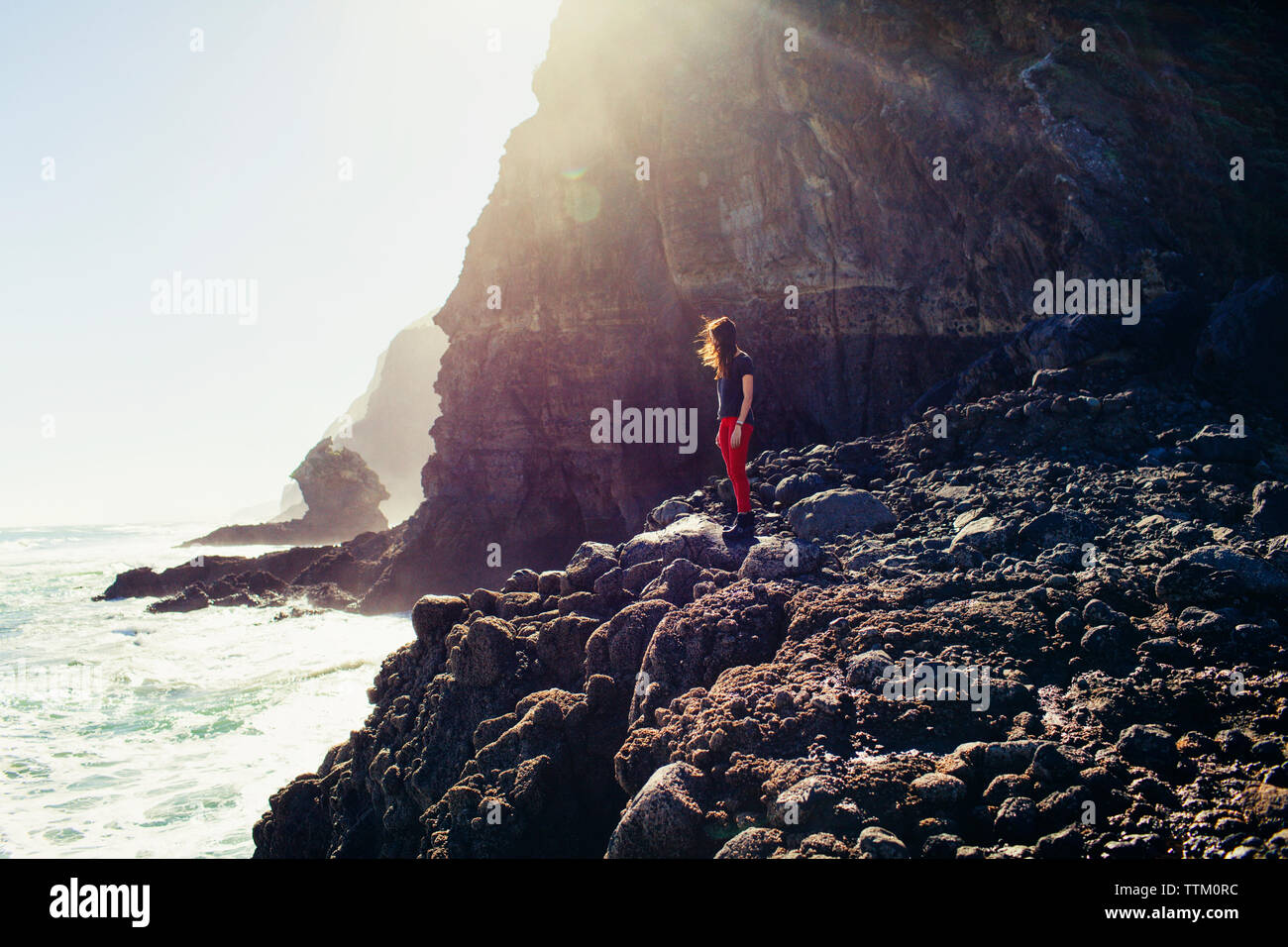 Standing on rocky beach person hi-res stock photography and images - Alamy