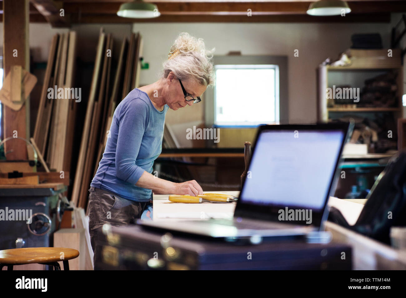 Female worker standing in workshop Stock Photo
