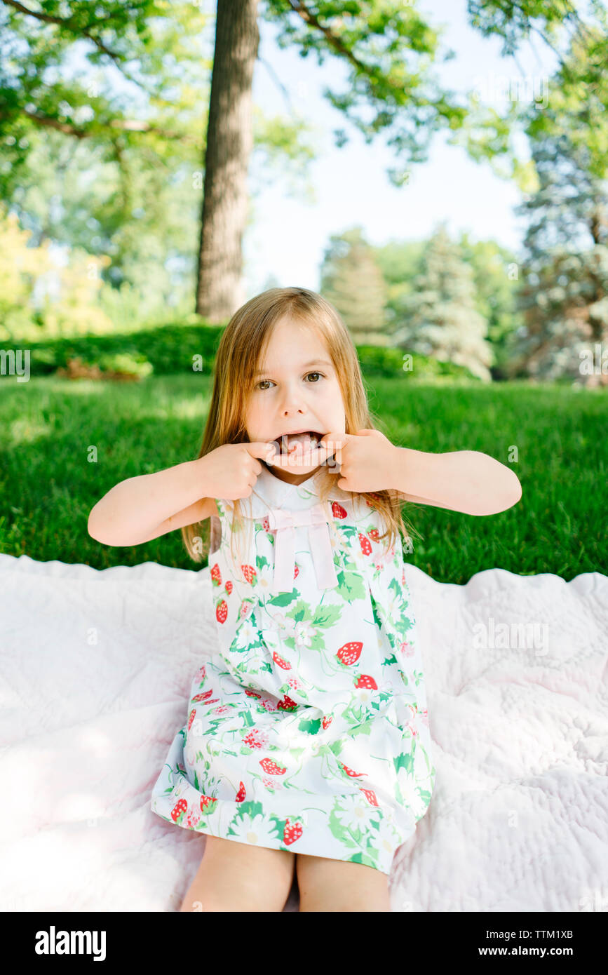Portrait of a young girl making a silly face Stock Photo