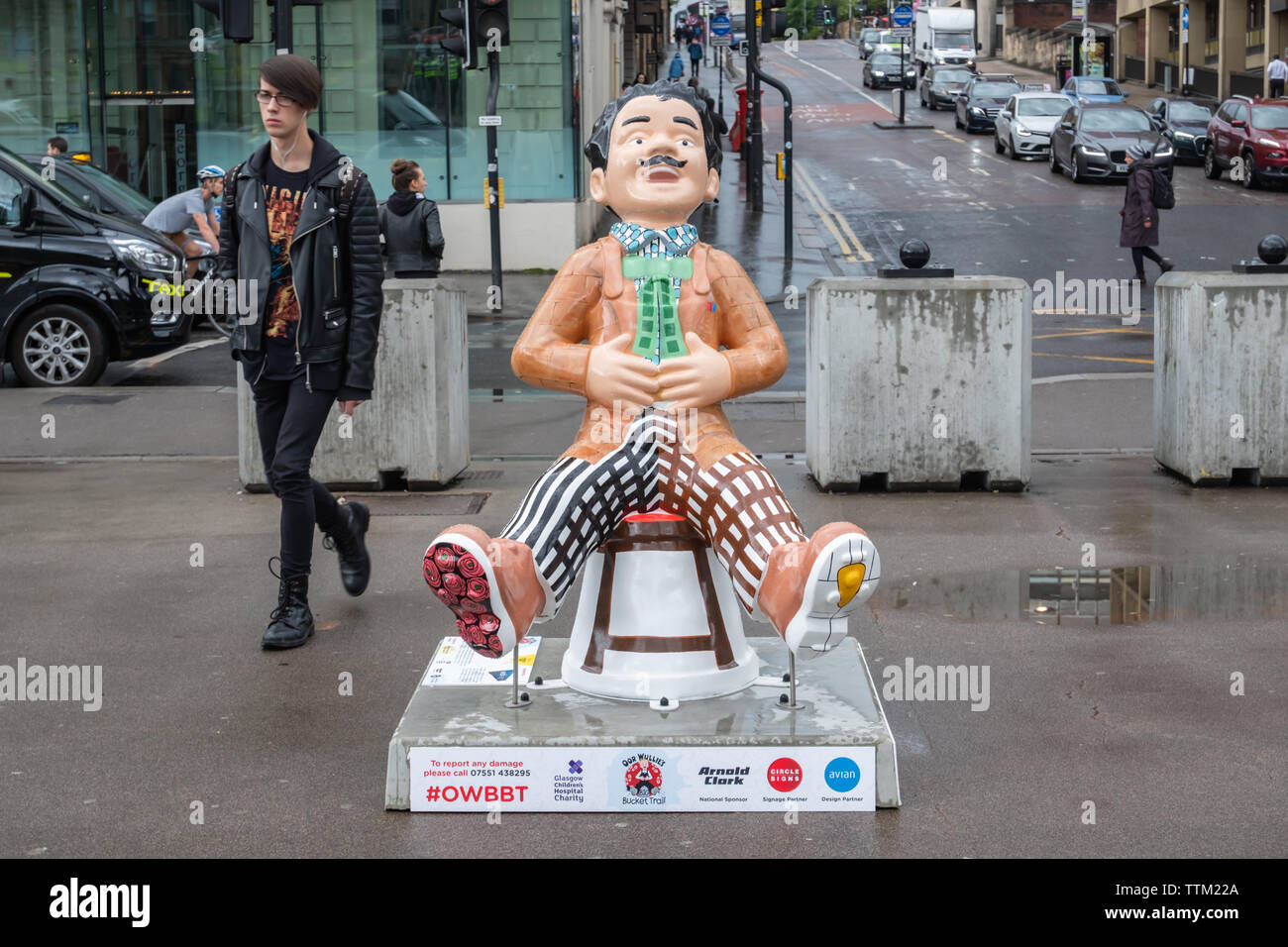 Glasgow, Scotland, UK. 17th June, 2019. Oor Charles, created by Laura Hallett. This statue sees Oor Wullie become one of Glasgow's most renowned artists and designers, Charles Rennie Mackintosh sitting on one of his famous funiture pieces. The work also includes stained glass windows, pattern design, architecture and interiors. His jacket mirrors the brickwork on The Glasgow School of Art. The sculpture is part of Oor Wullie’s BIG Bucket Trail. Credit: Skully/Alamy Live News Stock Photo