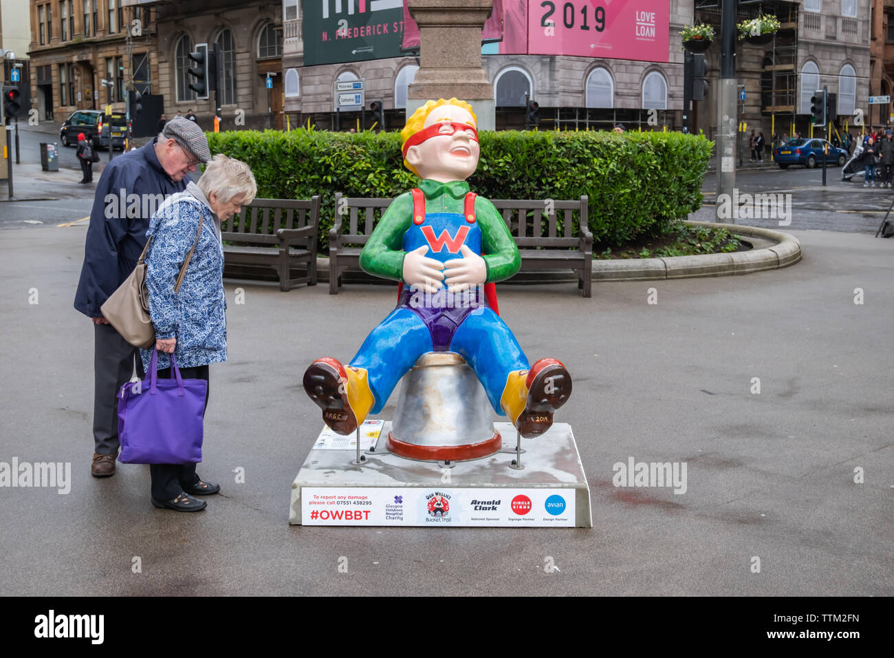 Glasgow, Scotland, UK. 17th June, 2019. Wonder Wullie, created by David RG Chapman. This statue sees Oor Wullie armed with an old curtain, dishcloth and Paw's Y-fronts. Oor hero's oot guisin' as Wonder Wullie. The sculpture is part of Oor Wullie’s BIG Bucket Trail. Credit: Skully/Alamy Live News Stock Photo