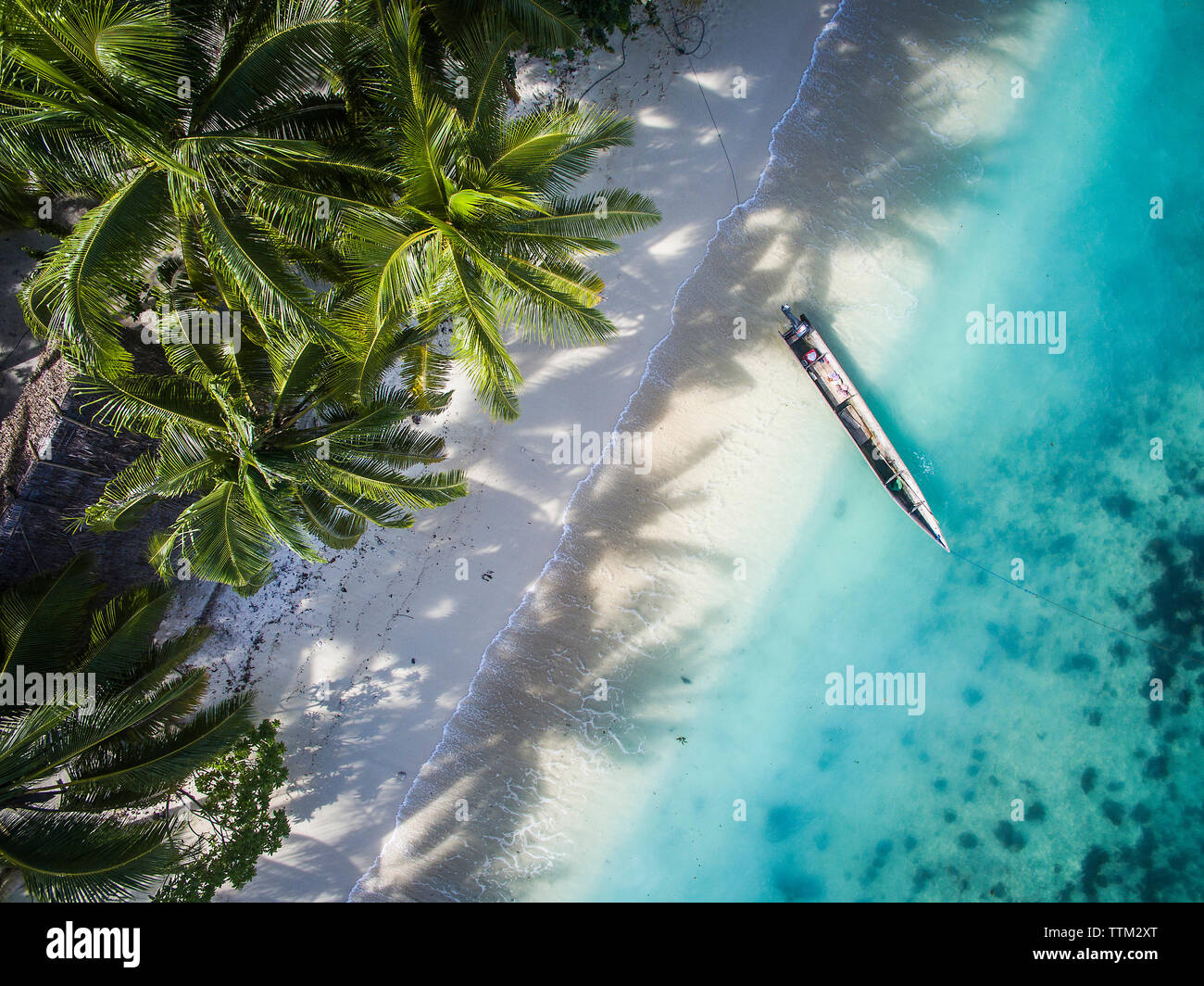 High angle view of boat moored on shore at Gam Island Stock Photo