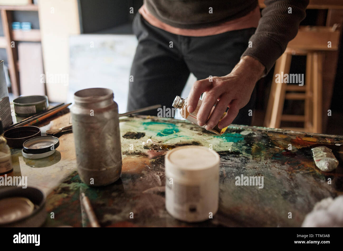 Male artist holding painting hi-res stock photography and images - Alamy