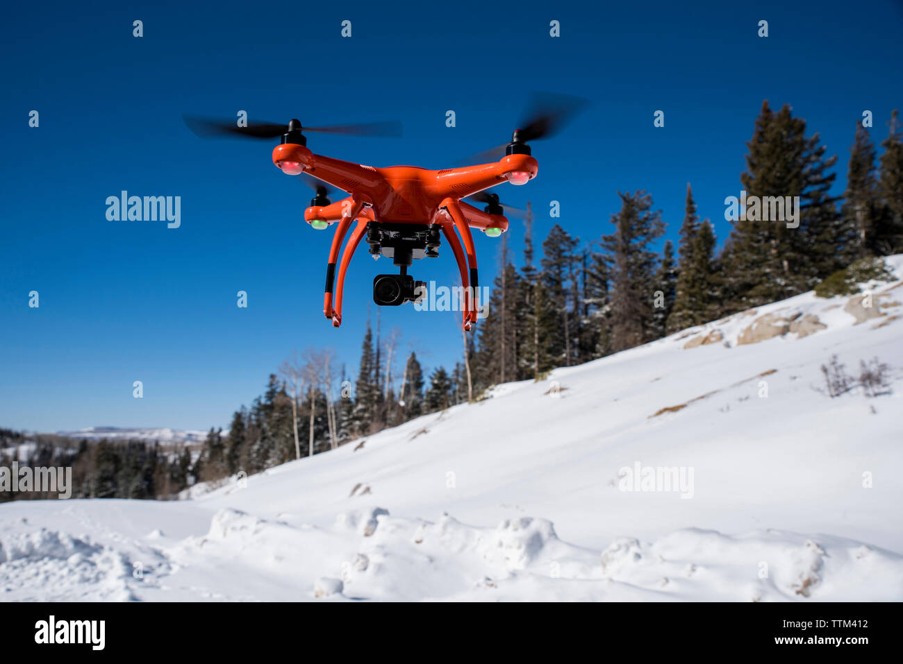 Close-up of drone flying over snow during winter Stock Photo