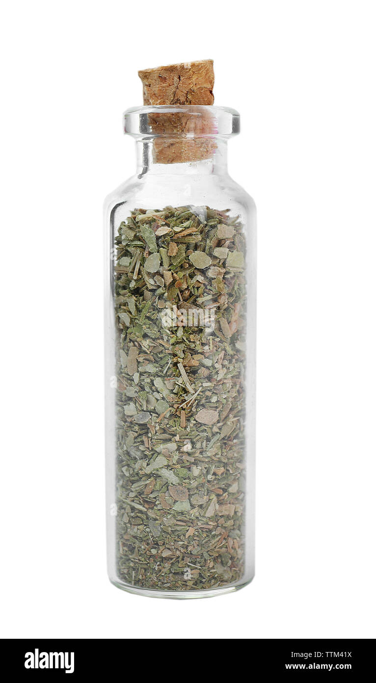 Dried oregano in glass bottle on white background Stock Photo Alamy