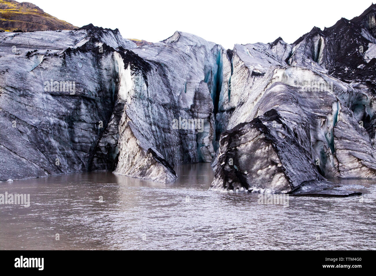 melting glacier covered in dirt in VatnajÃ¶kull National Park Stock Photo