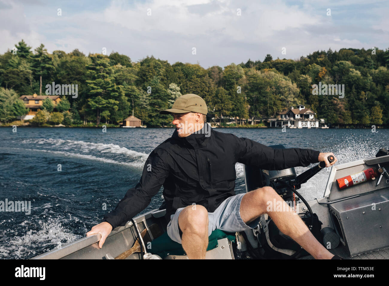 Man riding motorboat on Lake Rosseau Stock Photo - Alamy