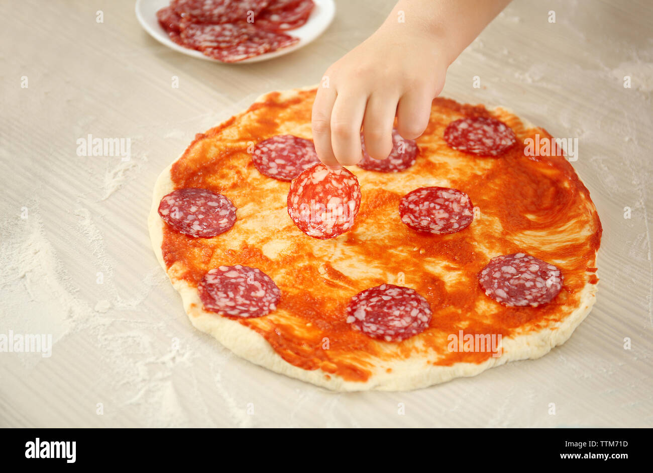 Kids with parents cooking dinner Stock Photo - Alamy