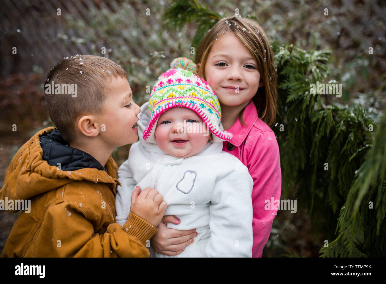 Portrait of cute siblings at backyard Stock Photo