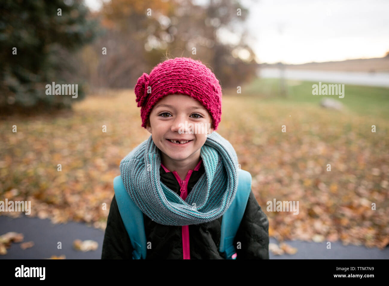 Portrait of girl standing on road during autumn Stock Photo