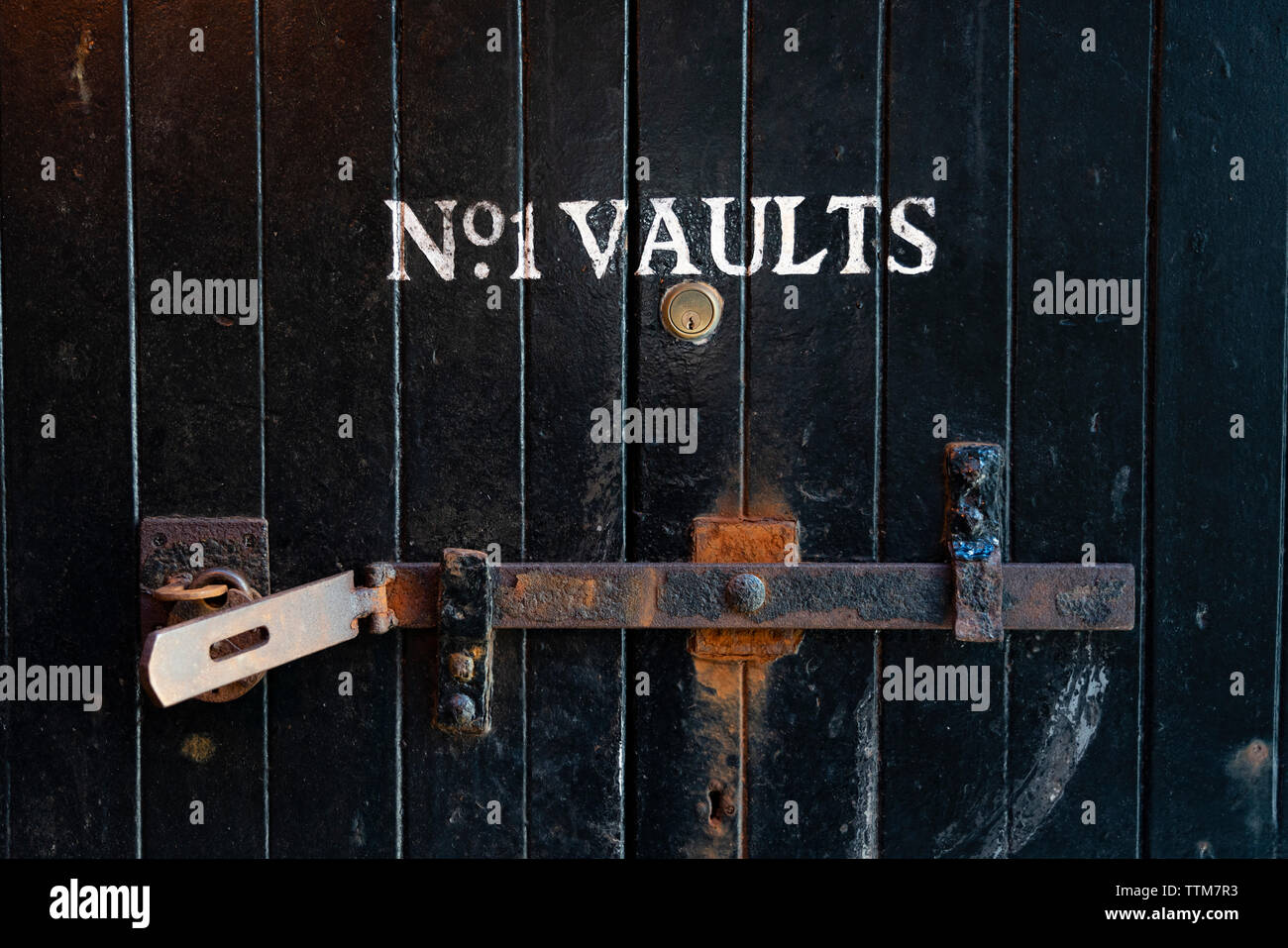 View of  warehouse door sign at Bowmore Distillery on island of Islay in Inner Hebrides of Scotland, UK Stock Photo