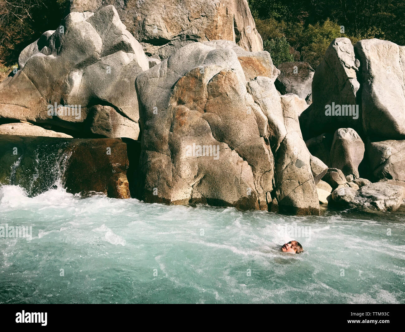 Boy swimming in Yuba River Stock Photo Alamy