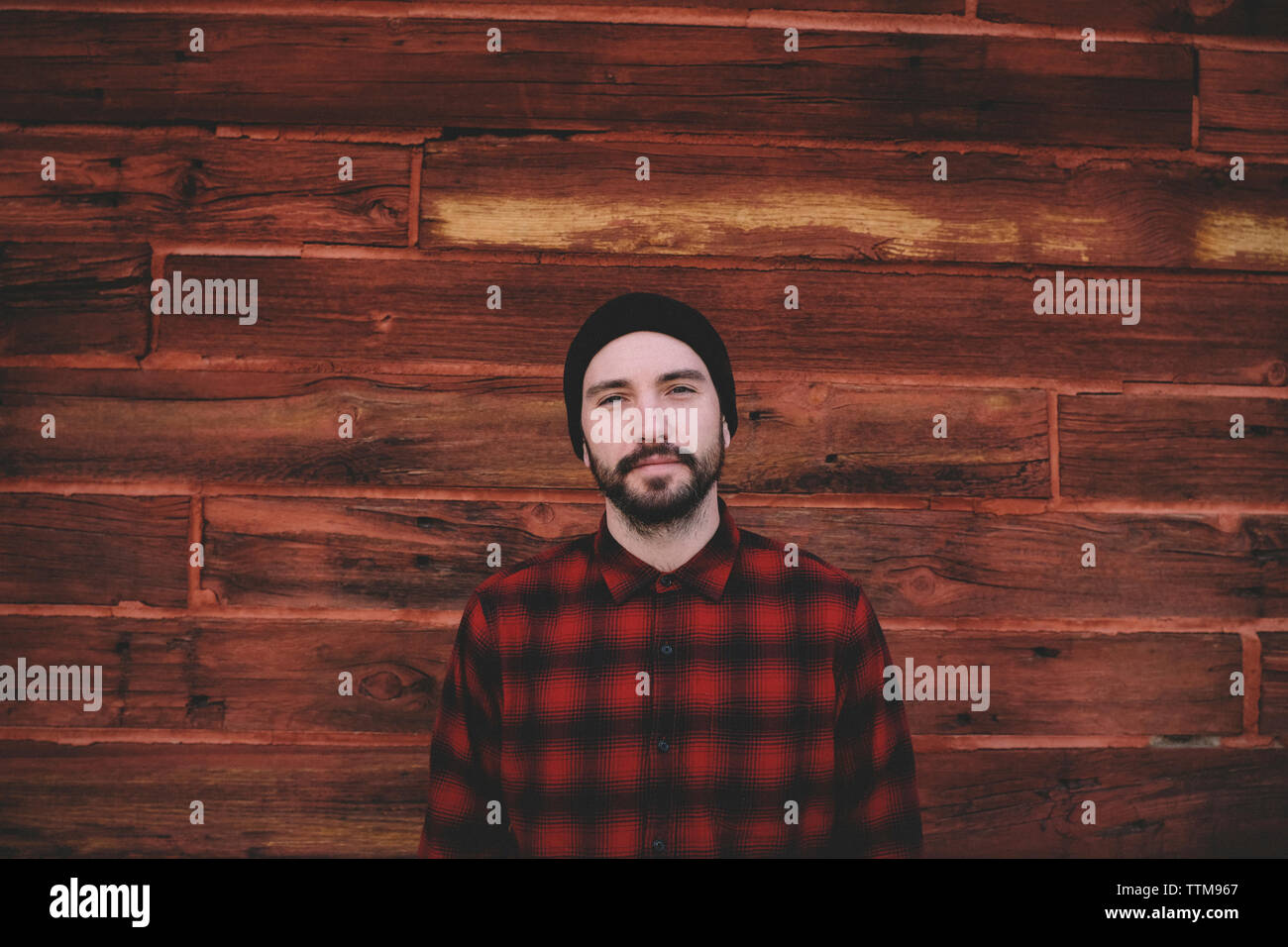 Man standing wall checked pattern hi-res stock photography and images ...
