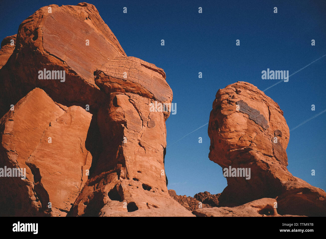 Low angle view of rock formations against clear blue sky at Valley of Fire State Park Stock Photo