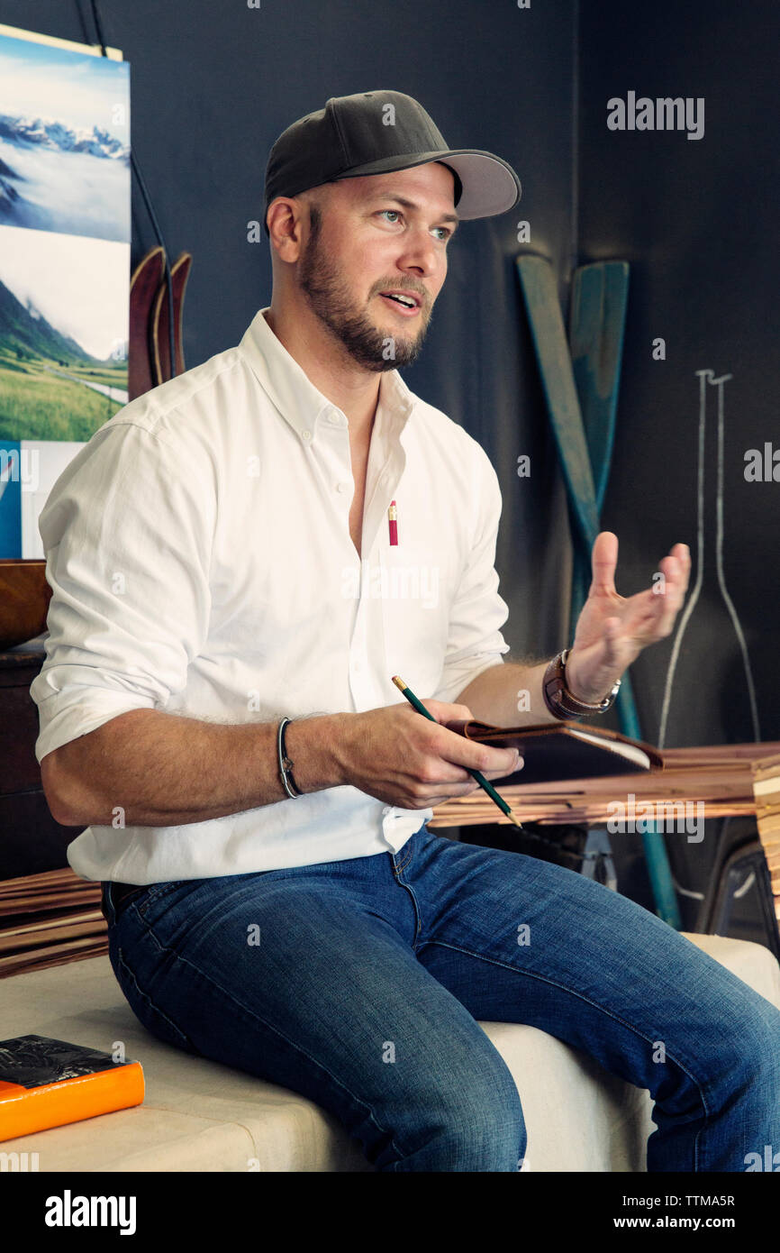 Craftsperson taking notes Stock Photo