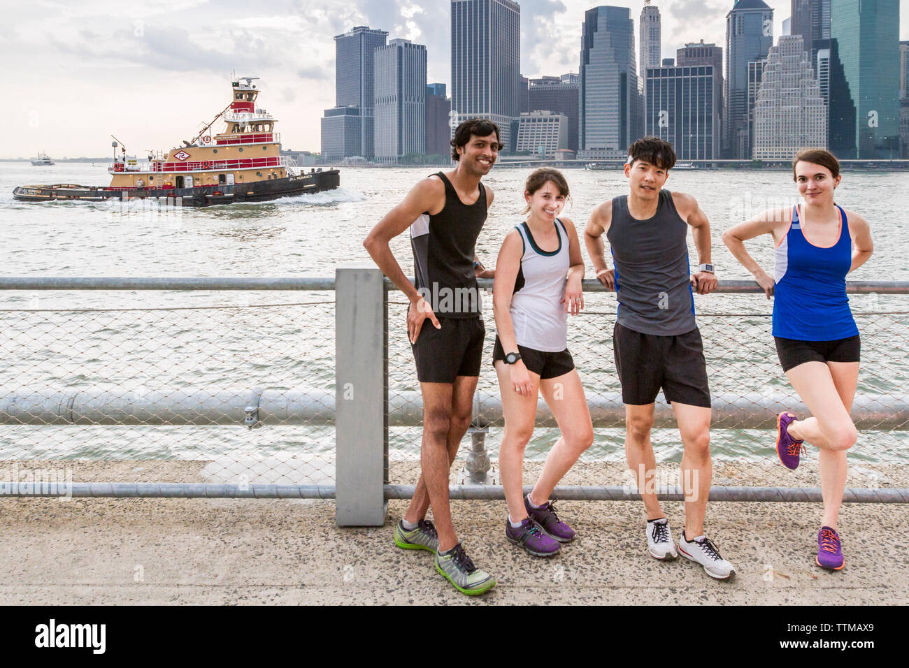 Group of runners after training on waterfront in Brooklyn Bridge Park