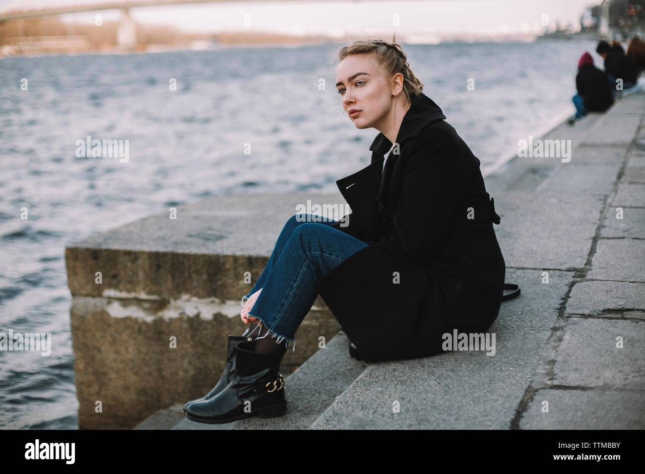 Young woman sitting steps hi-res stock photography and images - Alamy
