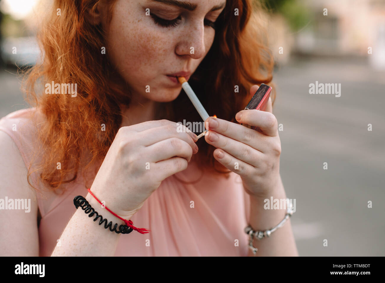 Beautiful Women Lighting Cigarettes