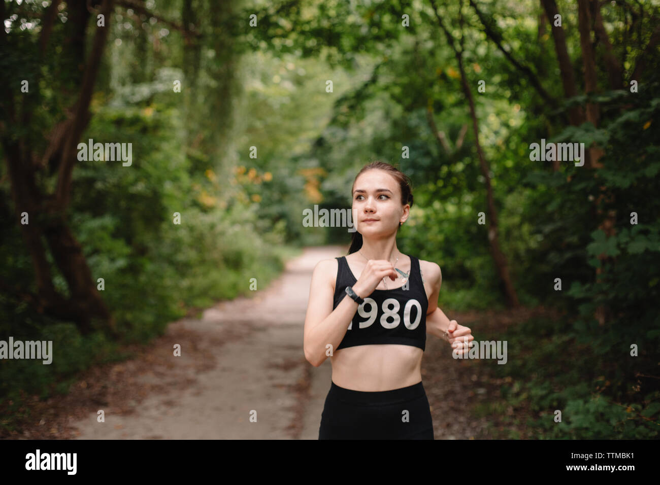 Young woman jogging at park Stock Photo