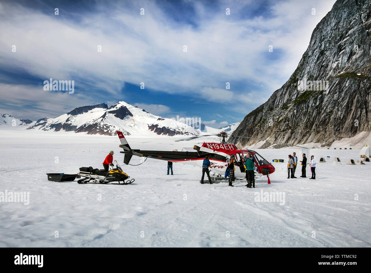 USA, Alaska, Juneau, Helicopter Dogsled Tour flies you over the Taku Glacier to the HeliMush dog camp at Guardian Mountain above the Taku Glacier, Jun Stock Photo