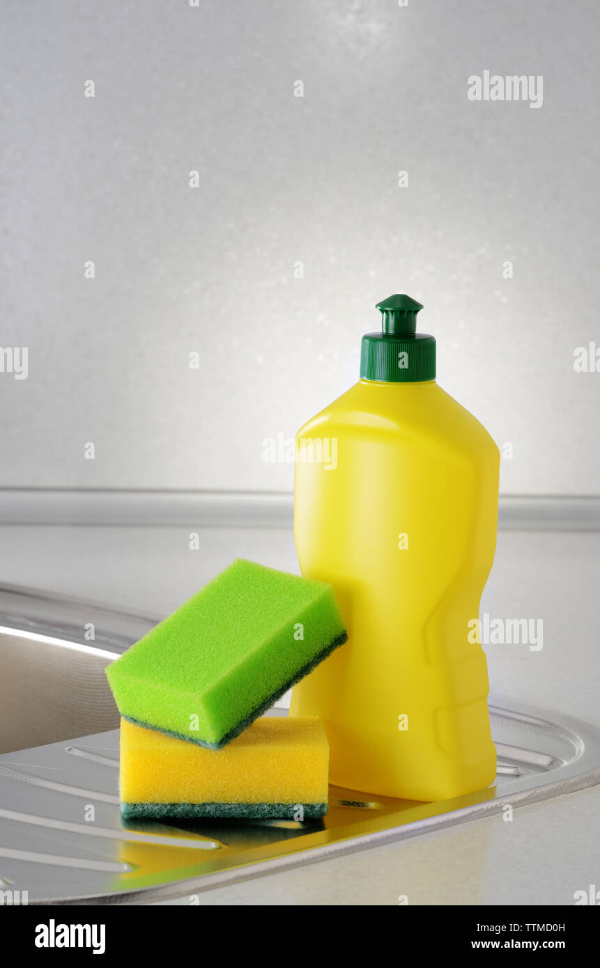 Dishwashing liquid with a sponge on kitchen sink Stock Photo Alamy