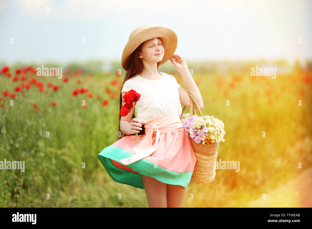 Beautiful girl in poppy field Stock Photo - Alamy