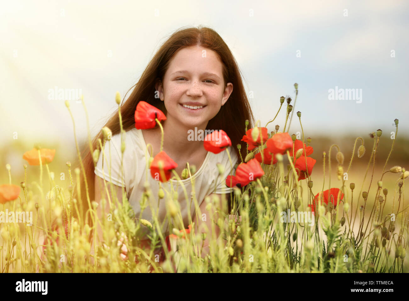 Beautiful girl in poppy field Stock Photo - Alamy