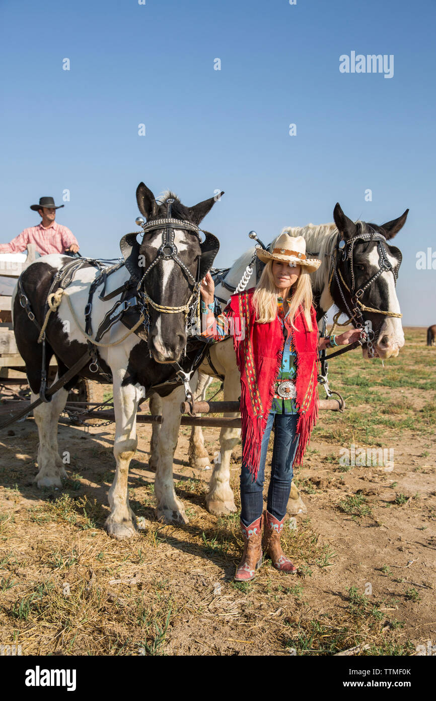 USA, Nevada, Wells, Founder Madeleine Pickens leads a HorseDrawn Wagon
