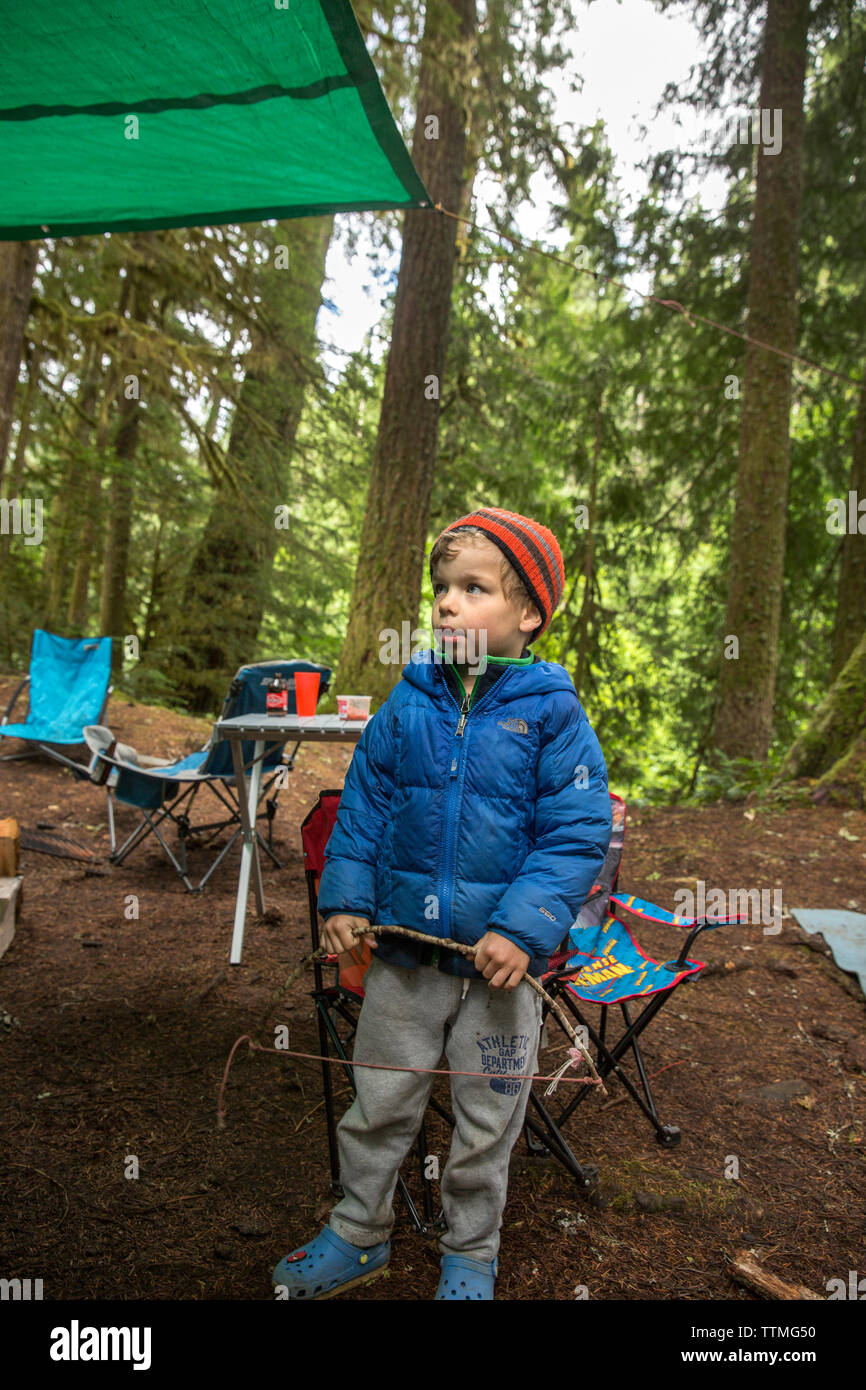 USA, Oregon, Santiam River, Brown Cannon, a young boy hanging out in a campground near the Santiam River in the Willamete National Forest Stock Photo