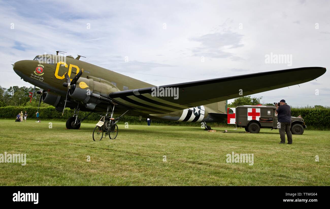 1942 Dodge WC54 Ambulance parked next to a 1944 C-47 Dakota “Betsy's Biscuit Bomber” at Shuttleworth to commemorate the 75th anniversary of D-Day. Stock Photo