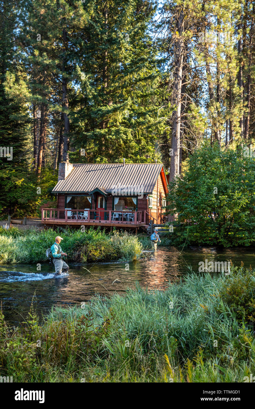 USA, Oregon, Camp Sherman, Metolius River Resort, Flyfishermen on the Metolius looking away from resort Stock Photo
