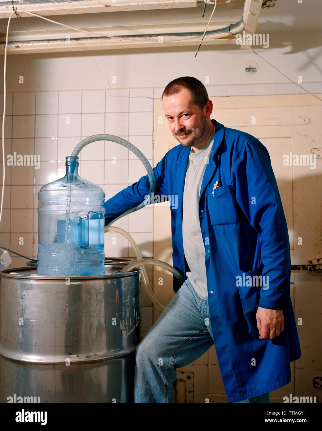 SWITZERLAND, Couvet, Absinthe maker Claude-Alain Bugnon at his Artemisia Distillerie, Jura Region Stock Photo