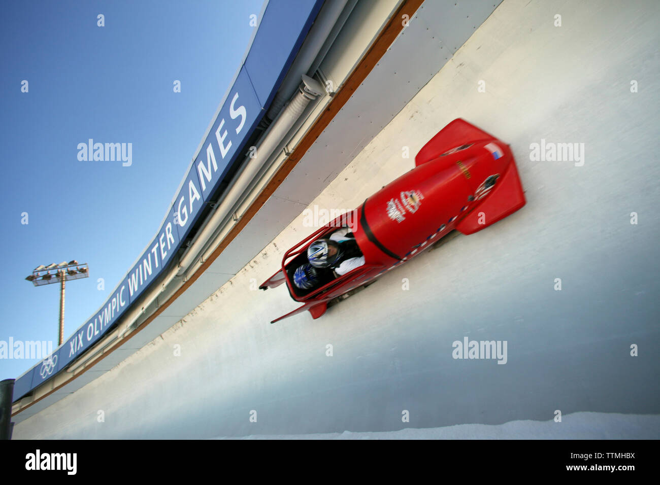 USA, Utah, Park City, a bobsled enters turn 12 at 80 miles per hour, Utah Olympic Park Stock Photo