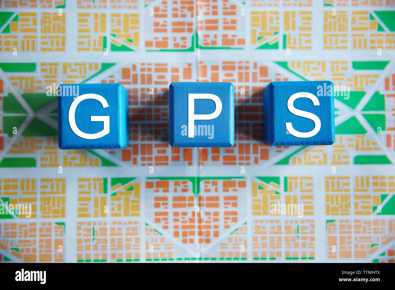 Cubes with word GPS on map background, top view Stock Photo