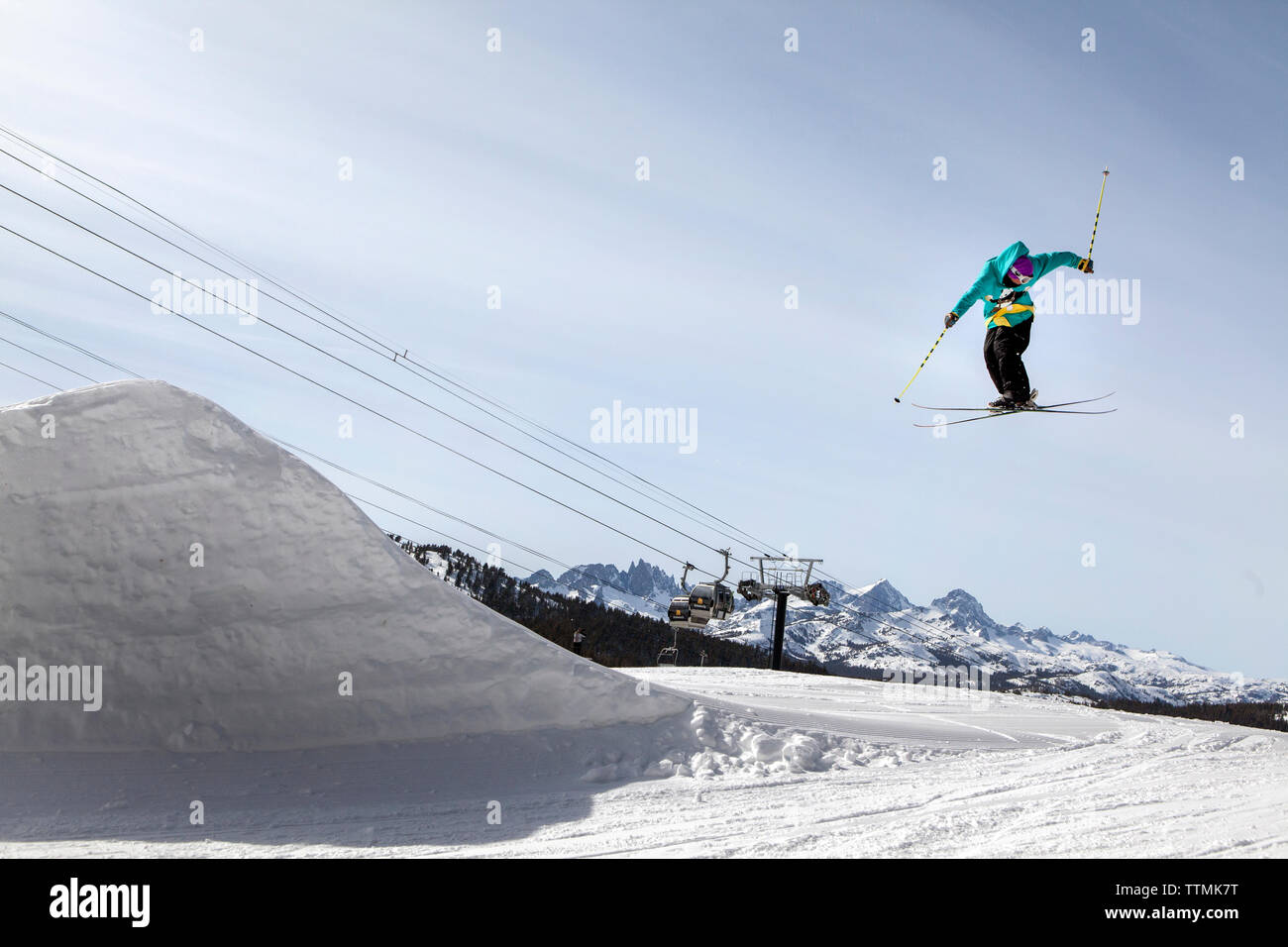 USA, California, Mammoth, a snowboarder catches air off a jump at Mammoth Ski Resort Stock Photo