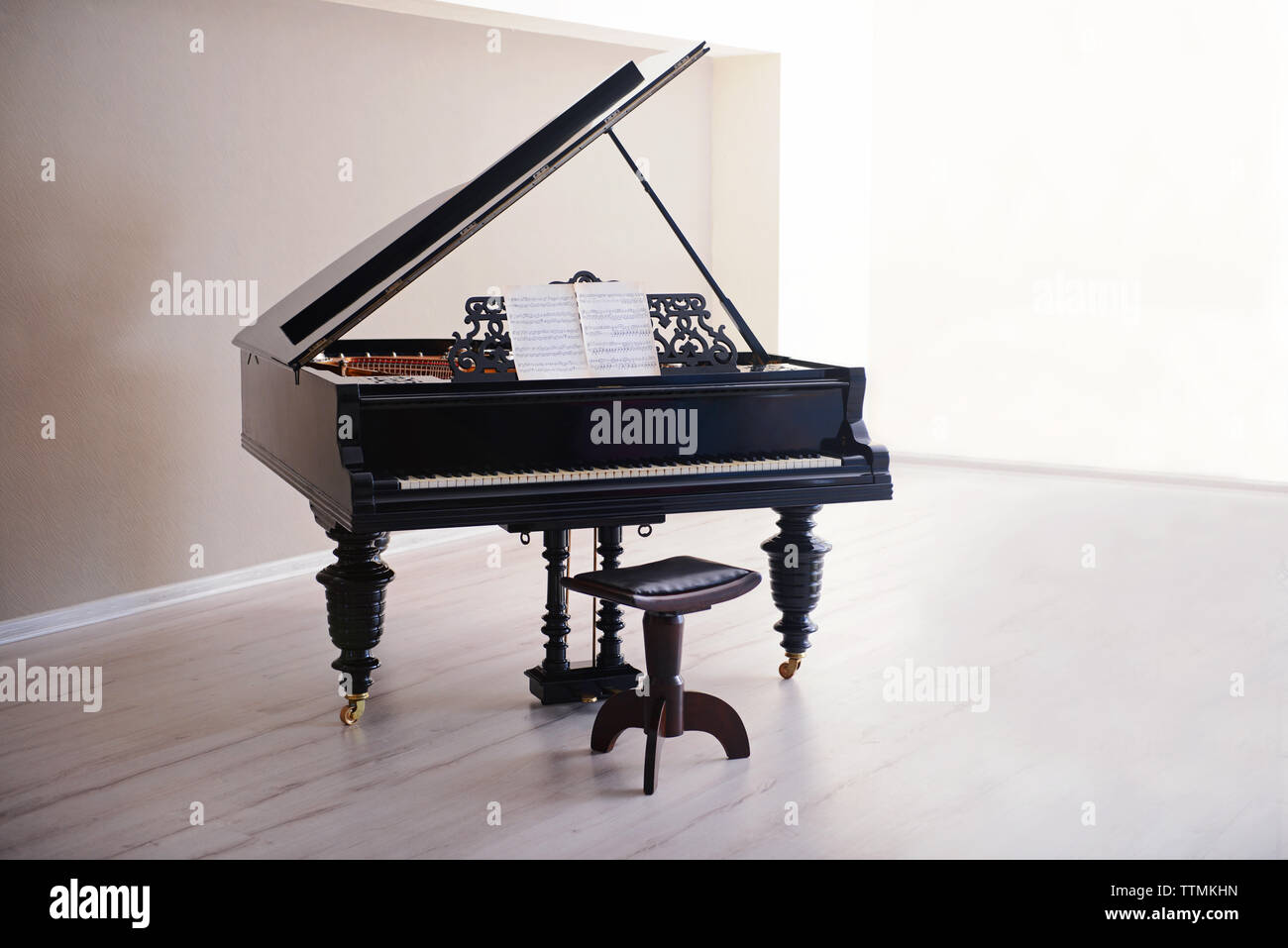 Classic piano in empty room Stock Photo - Alamy