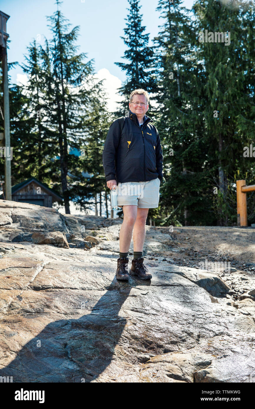 CANADA, Vancouver, British Columbia, portrait of Bert Gamerschlag at the top of Grouse Mountain after finishing The Grind hike Stock Photo